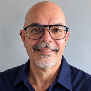 david headshot blue shirt cropped